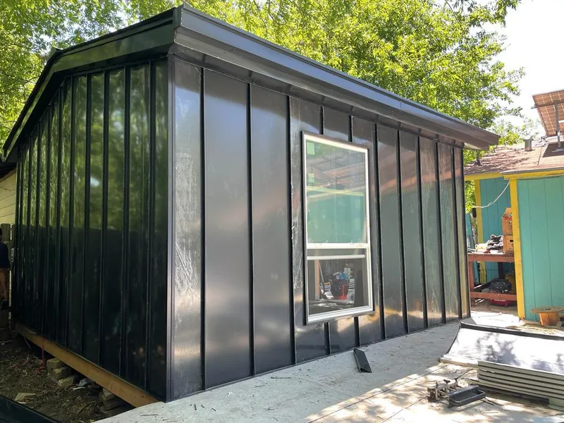 Black standing seam metal wall panels for Roof Inspection in Dodge City