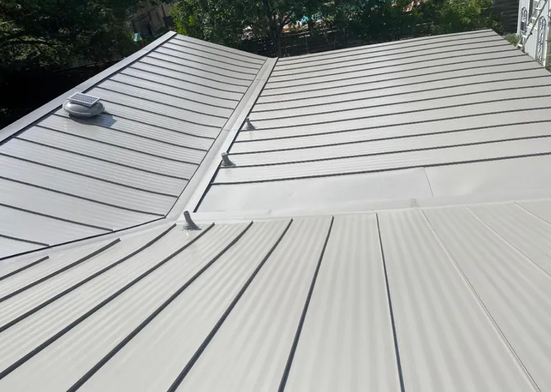 Solar attic fan installed on a metal roof for Roof Ventilation in Dodge City